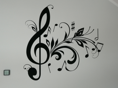 Naklejka welurowa na ścianę klucz wiolinowy z nutkami